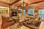Great room with flat screen TV and wood burning fireplace